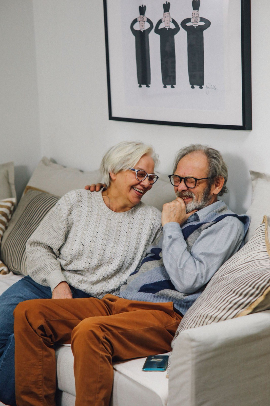 A retired couple at home, enjoying the wealth they have built